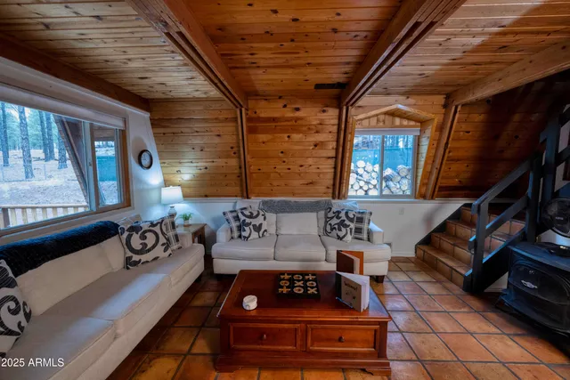 a view of a room with furniture and a window