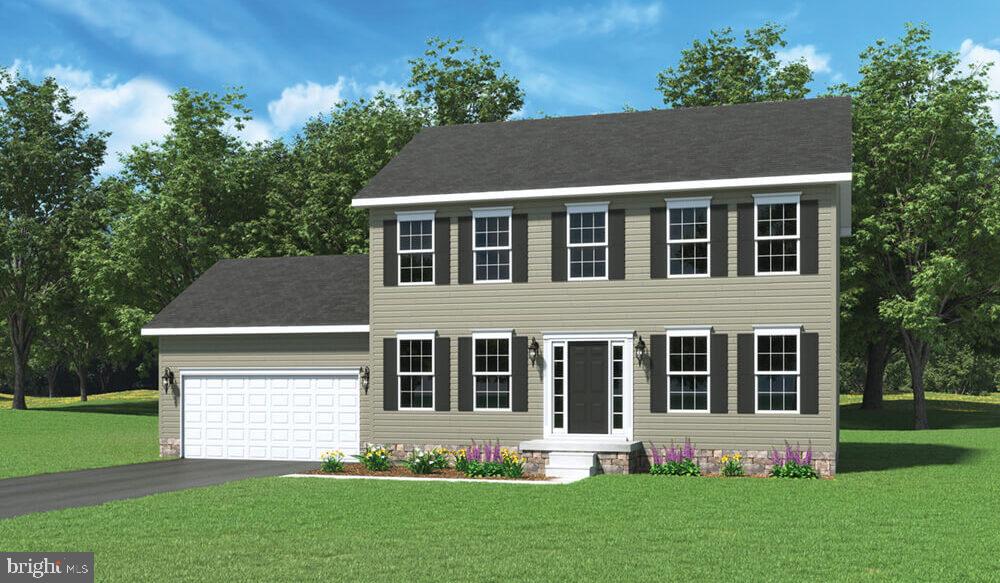 a aerial view of a house with a yard