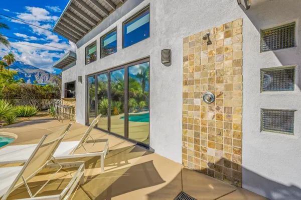 a view of a swimming pool with a yard