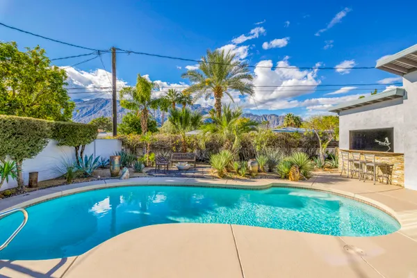 a view of a swimming pool with a patio