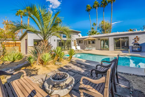 a view of a swimming pool with a patio