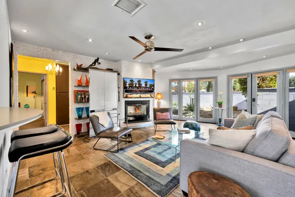 a living room with furniture or outdoor view and a large window