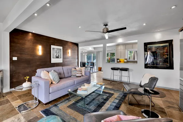 a living room with furniture and wooden floor