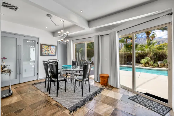 a view of a dining room with furniture window and outside view