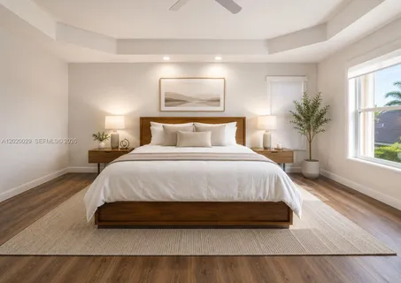 a spacious bedroom with a bed and a large window
