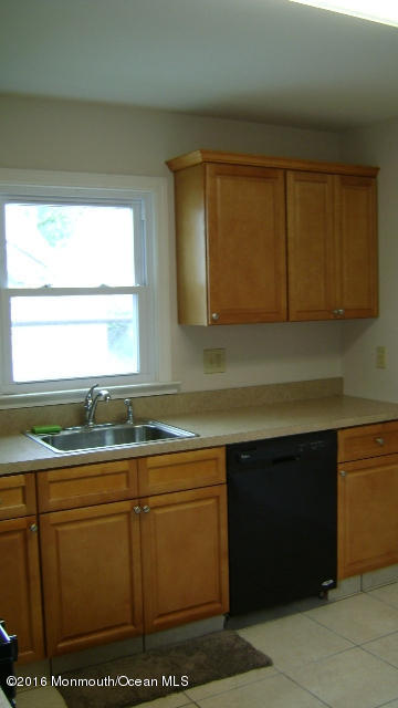 1807 Laurel Terrace Lake Como, NJ 07719 - Photo 4 of 9 a kitchen with sink cabinets and window