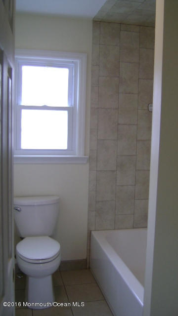 1807 Laurel Terrace Lake Como, NJ 07719 - Photo 6 of 9 a bathroom with a toilet bathtub and window