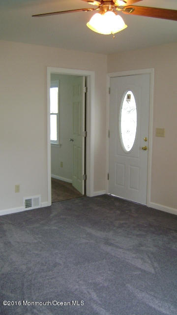 1807 Laurel Terrace Lake Como, NJ 07719 - Photo 9 of 9 a view of a livingroom with wooden floor and white walls