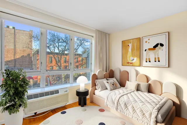 a view of empty room with wooden floor and entryway