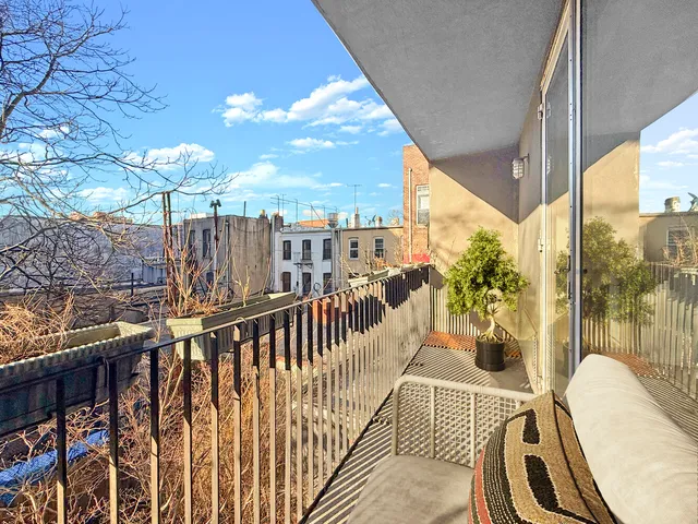 a view of a balcony with couch