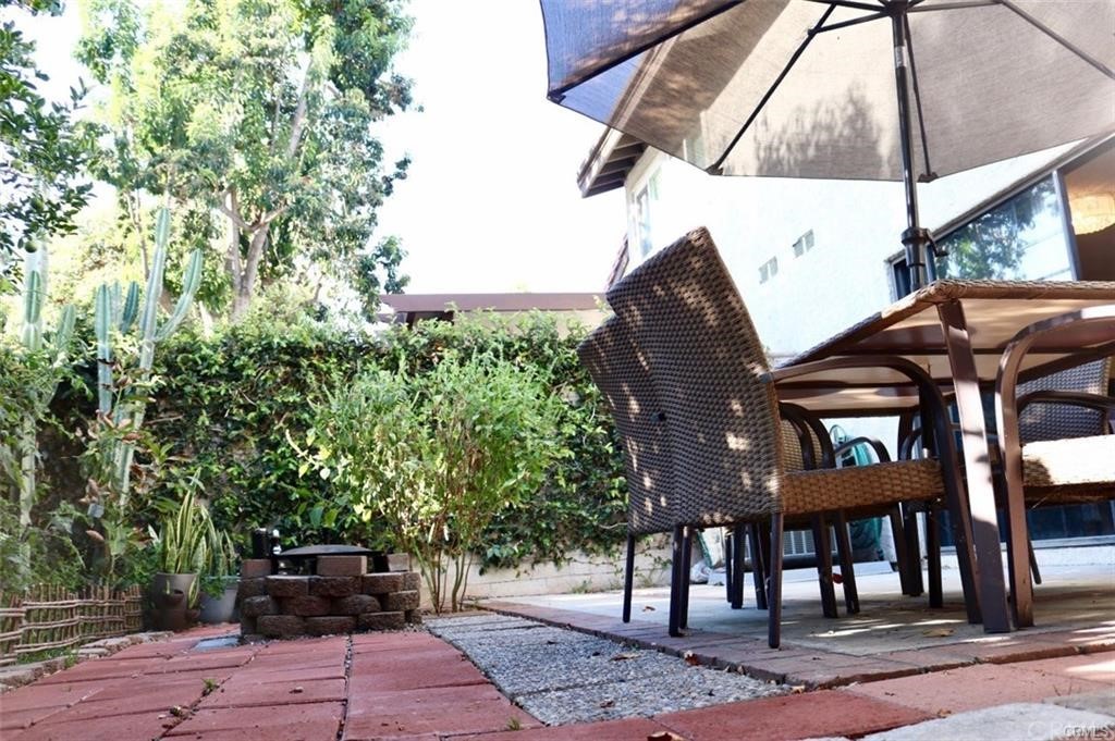 11810 Los Alisos Circle Norwalk, CA 90650 - Photo 13 of 26 Back Patio with greenery and brickwork.