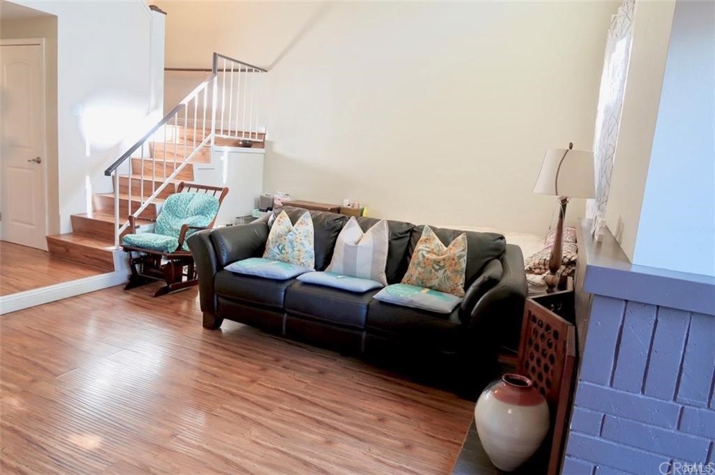 11810 Los Alisos Circle Norwalk, CA 90650 - Photo 8 of 26 standing by fireplace looking out to living area