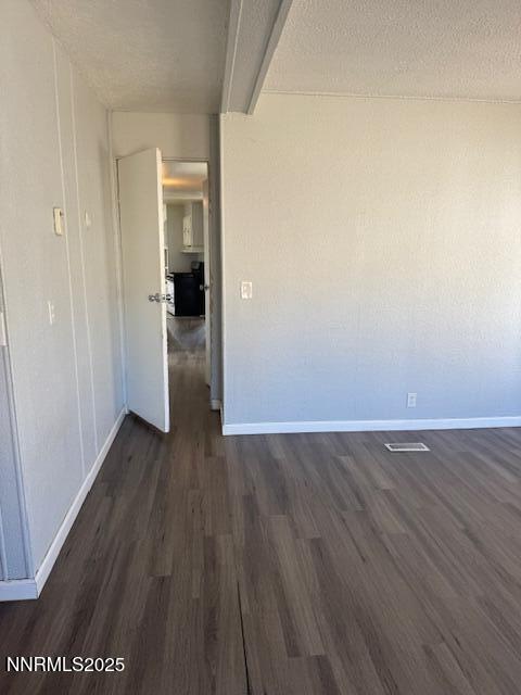241 Harmony Lane Sun Valley, NV 89433 - Photo 12 of 29 a view of an empty room with wooden floor