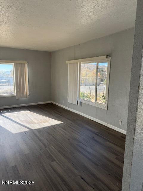 241 Harmony Lane Sun Valley, NV 89433 - Photo 15 of 29 an empty room with wooden floor and windows