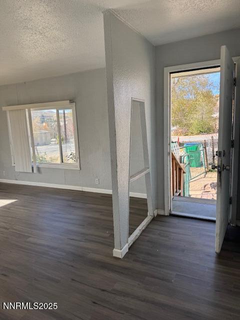 241 Harmony Lane Sun Valley, NV 89433 - Photo 16 of 29 an empty room with wooden floor and windows