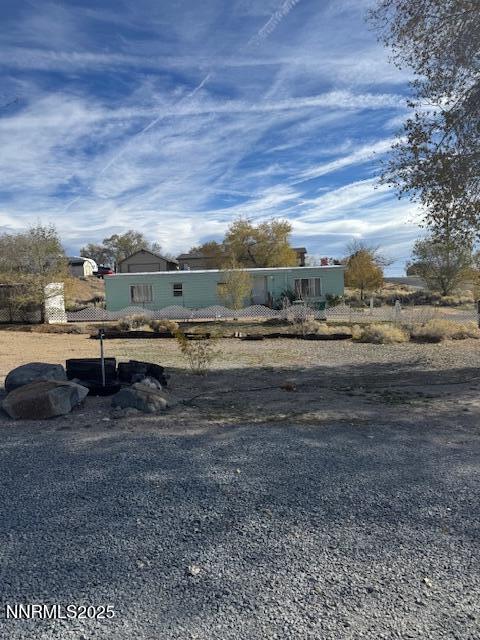 241 Harmony Lane Sun Valley, NV 89433 - Photo 17 of 29 a view of a big room with wooden fence