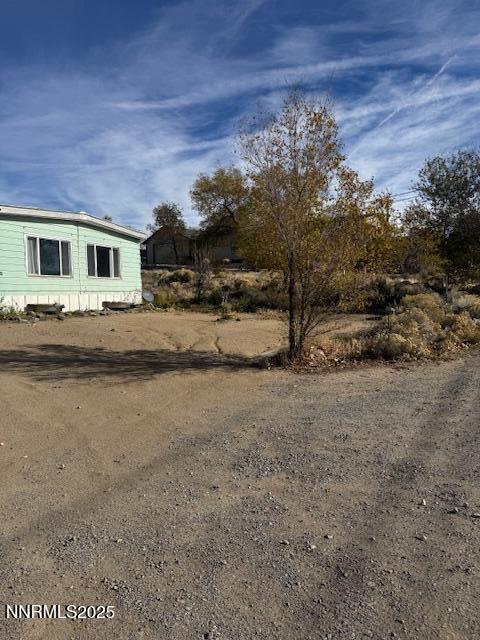 241 Harmony Lane Sun Valley, NV 89433 - Photo 21 of 29 a view of a house with a yard