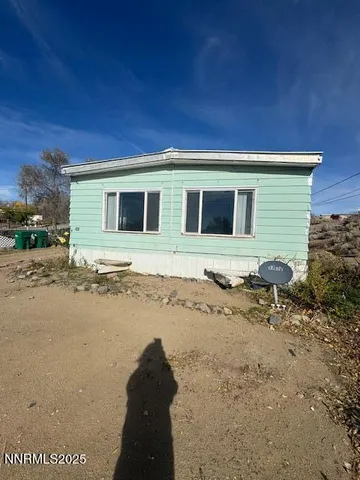 a view of a backyard of the house