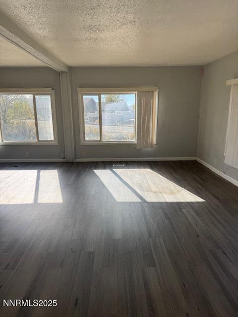 241 Harmony Lane Sun Valley, NV 89433 - Photo 27 of 29 an empty room with wooden floor and windows