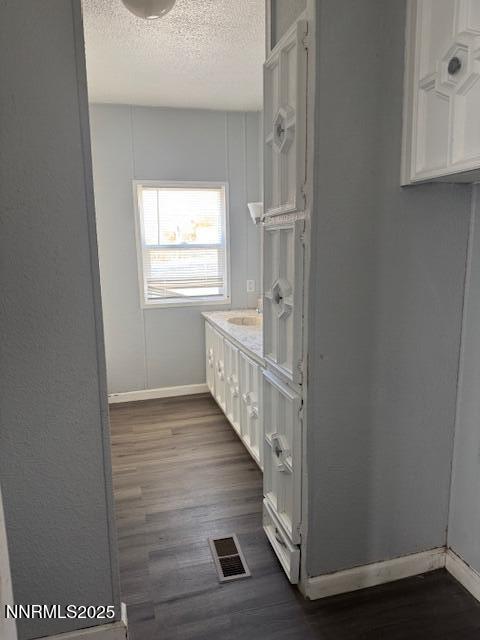241 Harmony Lane Sun Valley, NV 89433 - Photo 9 of 29 a view of a hallway with wooden floor and staircase