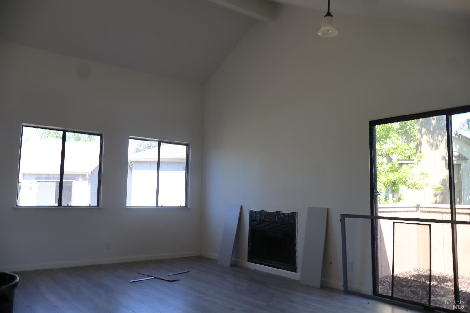 2599 Westberry Drive Santa Rosa, CA 95403 - Photo 5 of 6 a view of an empty room with wooden floor and a window