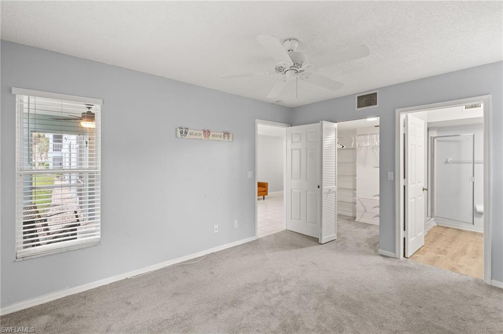 161 Wading Bird Circle, Unit L101 Naples, FL 34110 - Photo 12 of 35 a view of an empty room with a window