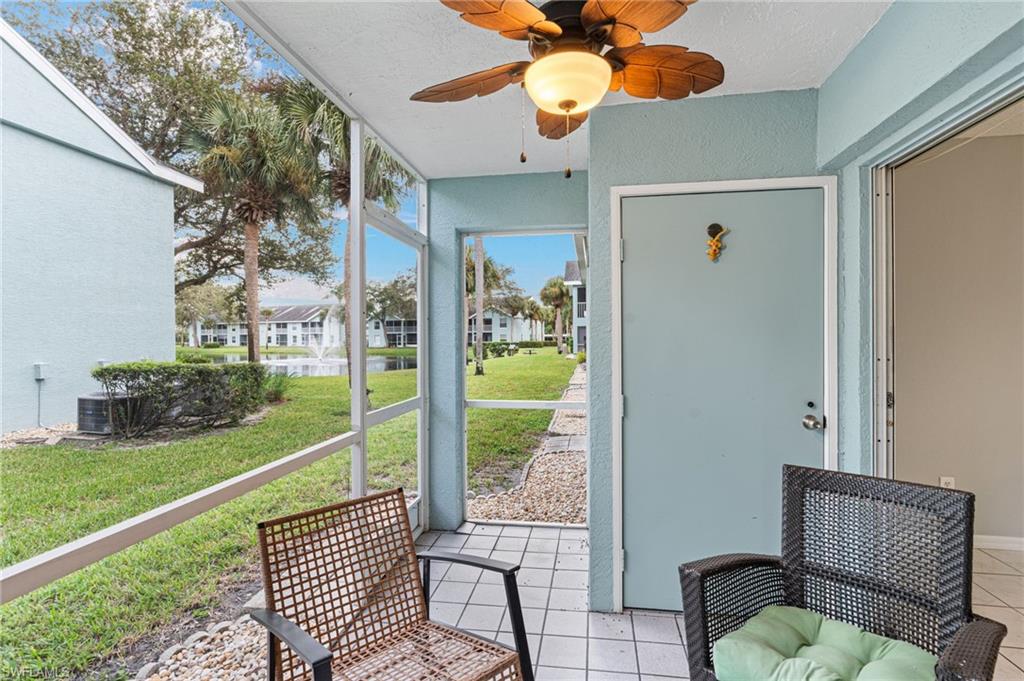 161 Wading Bird Circle, Unit L101 Naples, FL 34110 - Photo 22 of 35 a view of a porch with furniture and garden