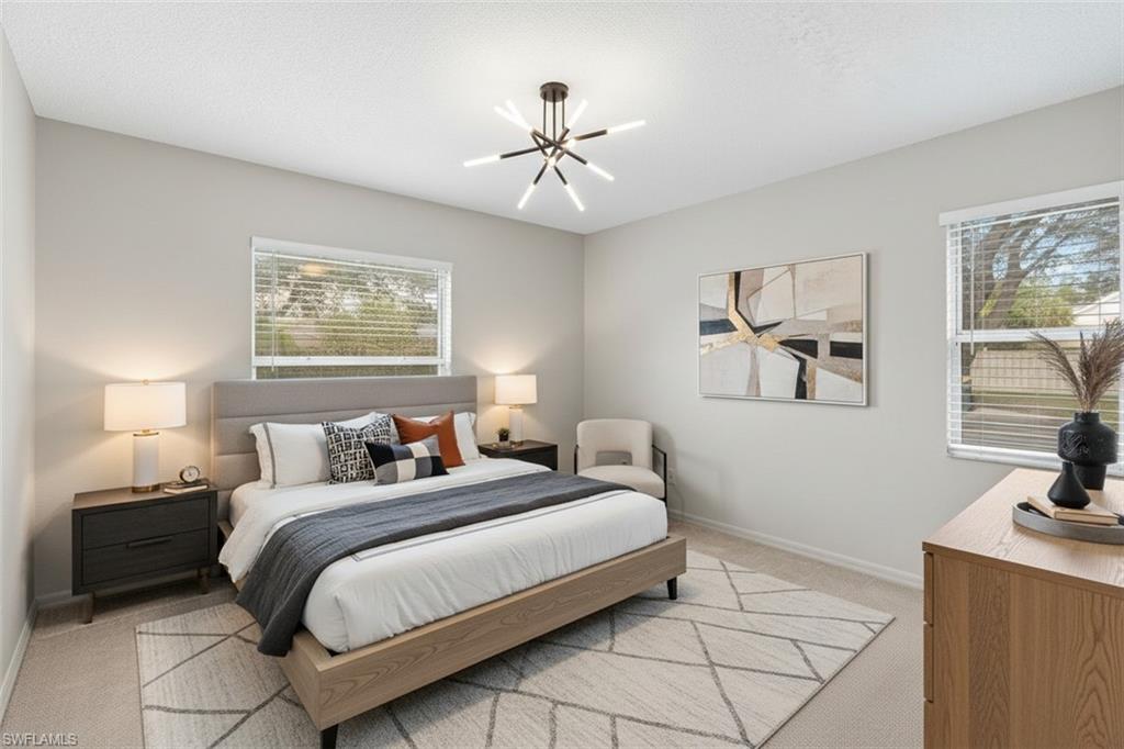 161 Wading Bird Circle, Unit L101 Naples, FL 34110 - Photo 26 of 44 Bedroom virtual staged with light carpet and suspended lighting