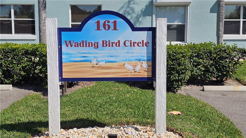 161 Wading Bird Circle, Unit L101 Naples, FL 34110 - Photo 35 of 35 a sign that is on the side of a building