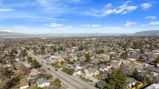 4426 South 3035 East Holladay, UT 84124 - Photo 46 of 49 Aerial view of property's location with a mountain backdrop and nearby suburban area