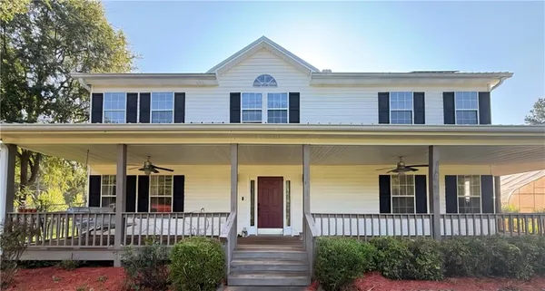a front view of a house with a porch