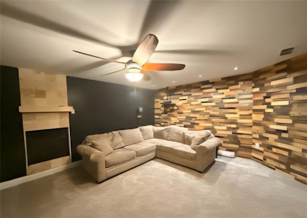 1599 Lower River Road Covington, GA 30016 - Photo 11 of 23 a living room with furniture and a fireplace