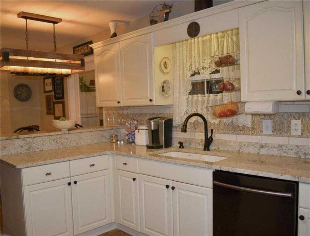 1599 Lower River Road Covington, GA 30016 - Photo 3 of 23 a bathroom with a granite countertop sink and a mirror