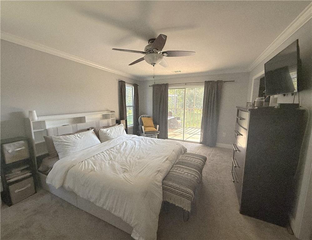 1599 Lower River Road Covington, GA 30016 - Photo 5 of 23 a bedroom with a bed tv and a window