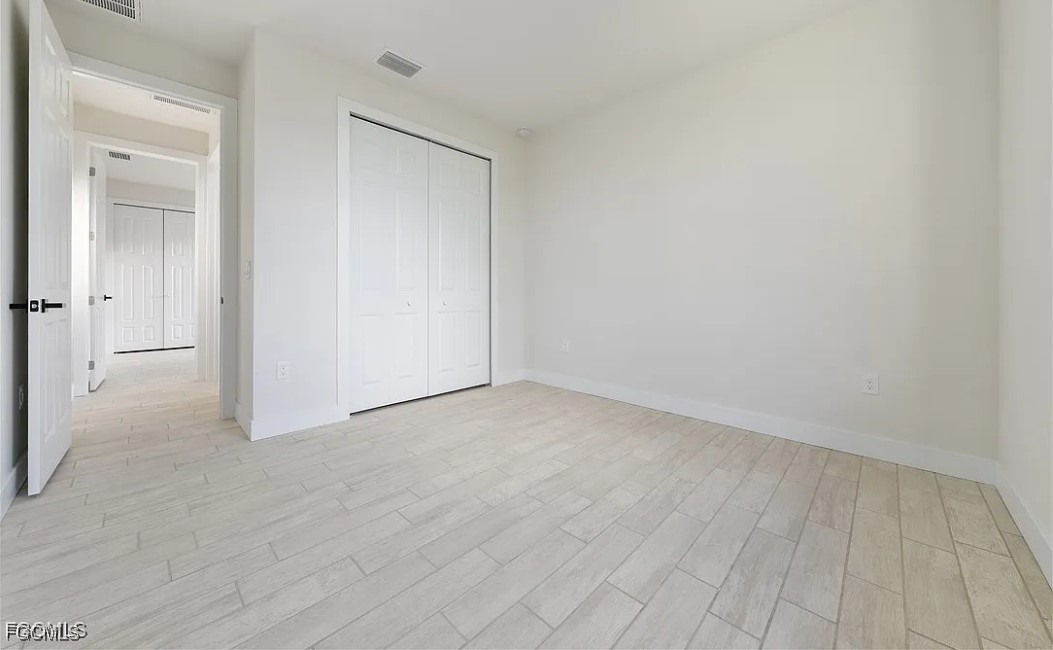 2719 42nd Street West Lehigh Acres, FL 33971 - Photo 11 of 20 wooden floor in a room