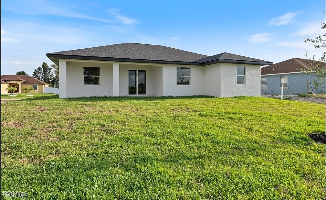 2719 42nd Street West Lehigh Acres, FL 33971 - Photo 20 of 20 a front view of a house with garden