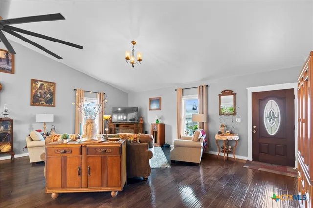 a work room with furniture and wooden floor