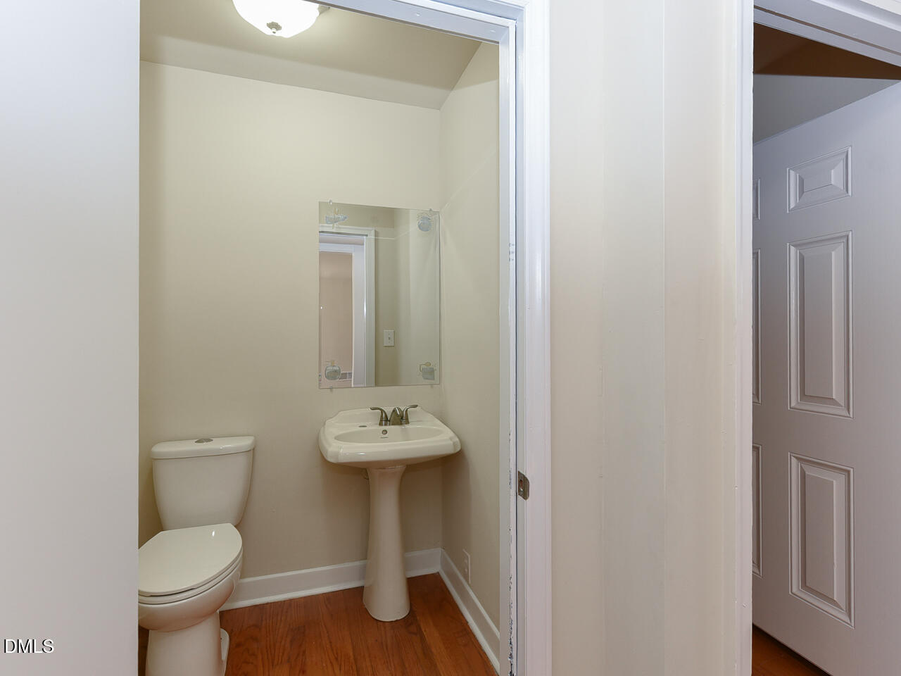 4916 Western Boulevard Raleigh, NC 27606 - Photo 12 of 18 a bathroom with a toilet sink and mirror