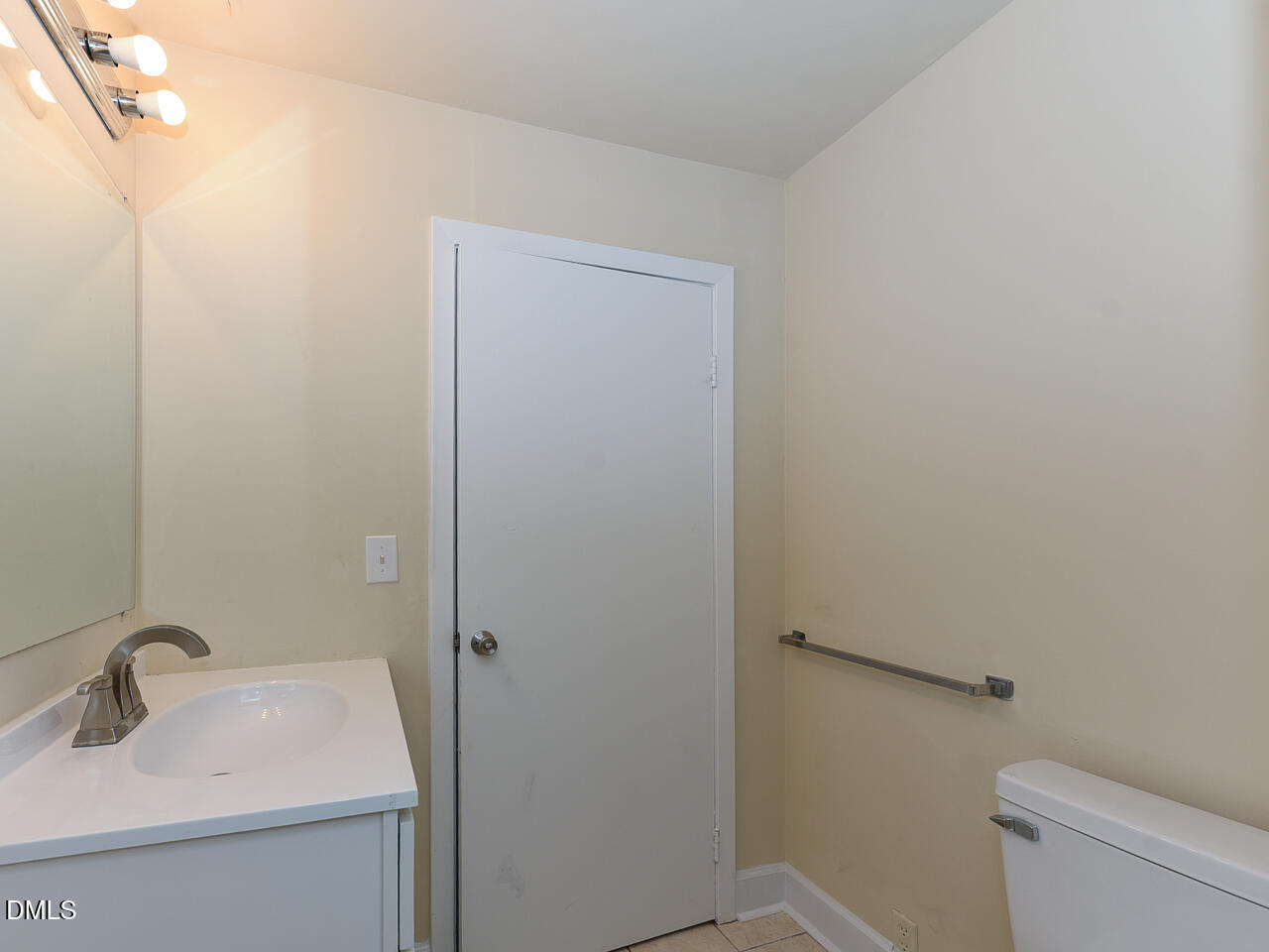 4916 Western Boulevard Raleigh, NC 27606 - Photo 18 of 18 a bathroom with a sink toilet and a mirror