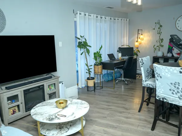 a living room with furniture and a fireplace