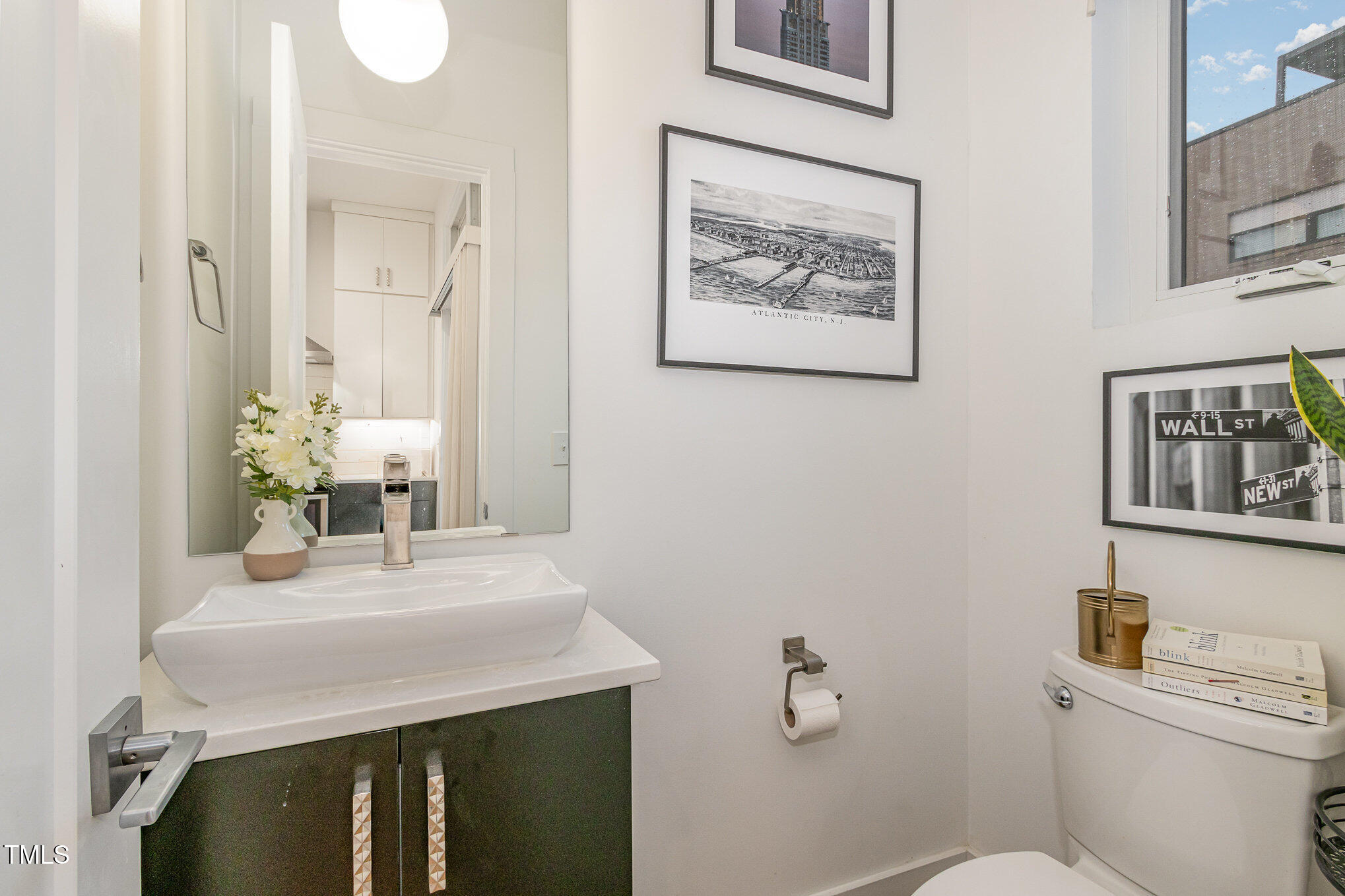 607 North Queen Street Durham, NC 27701 - Photo 11 of 35 a bathroom with a sink and a toilet