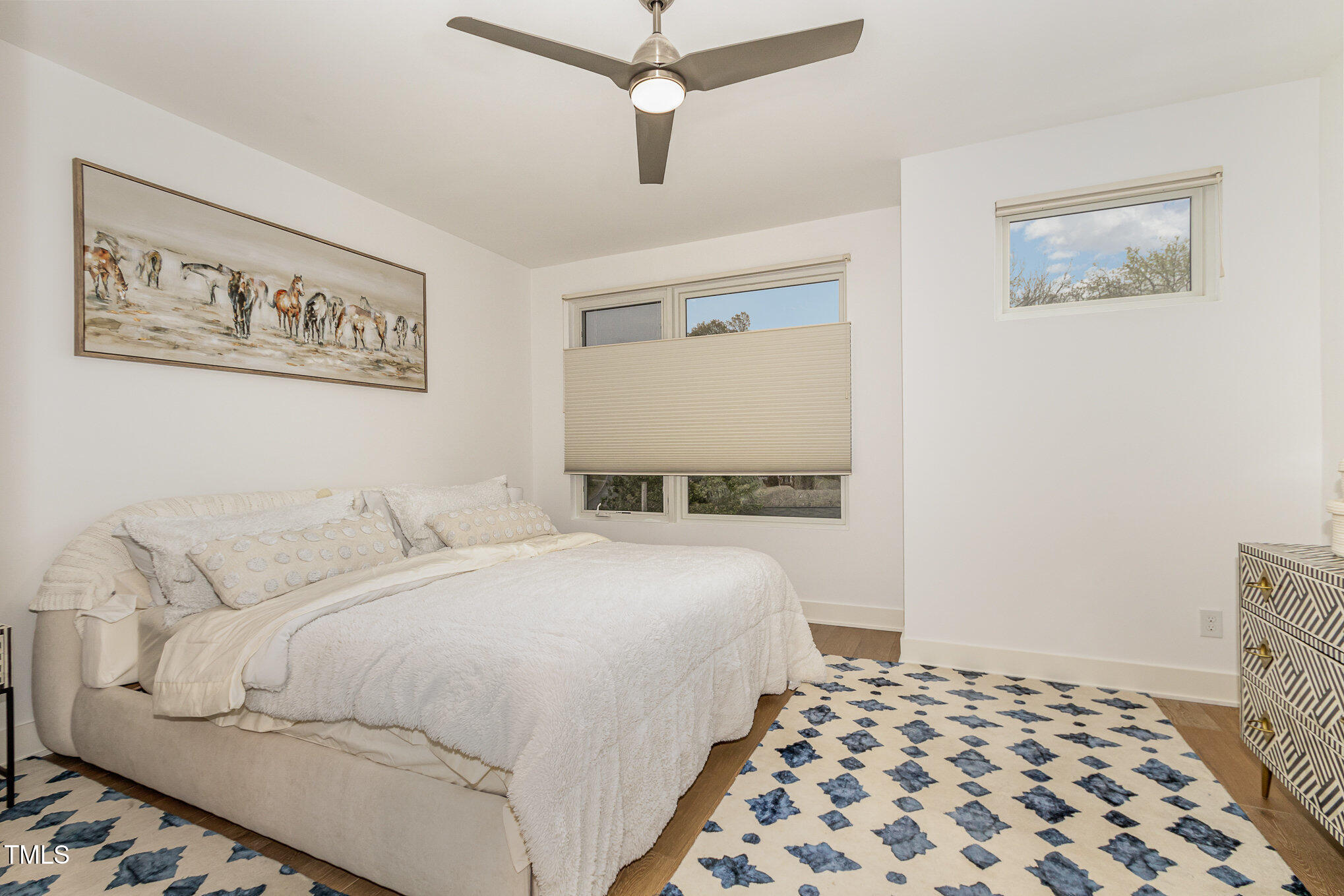 607 North Queen Street Durham, NC 27701 - Photo 15 of 35 a bedroom with a bed and a lamp on the dresser