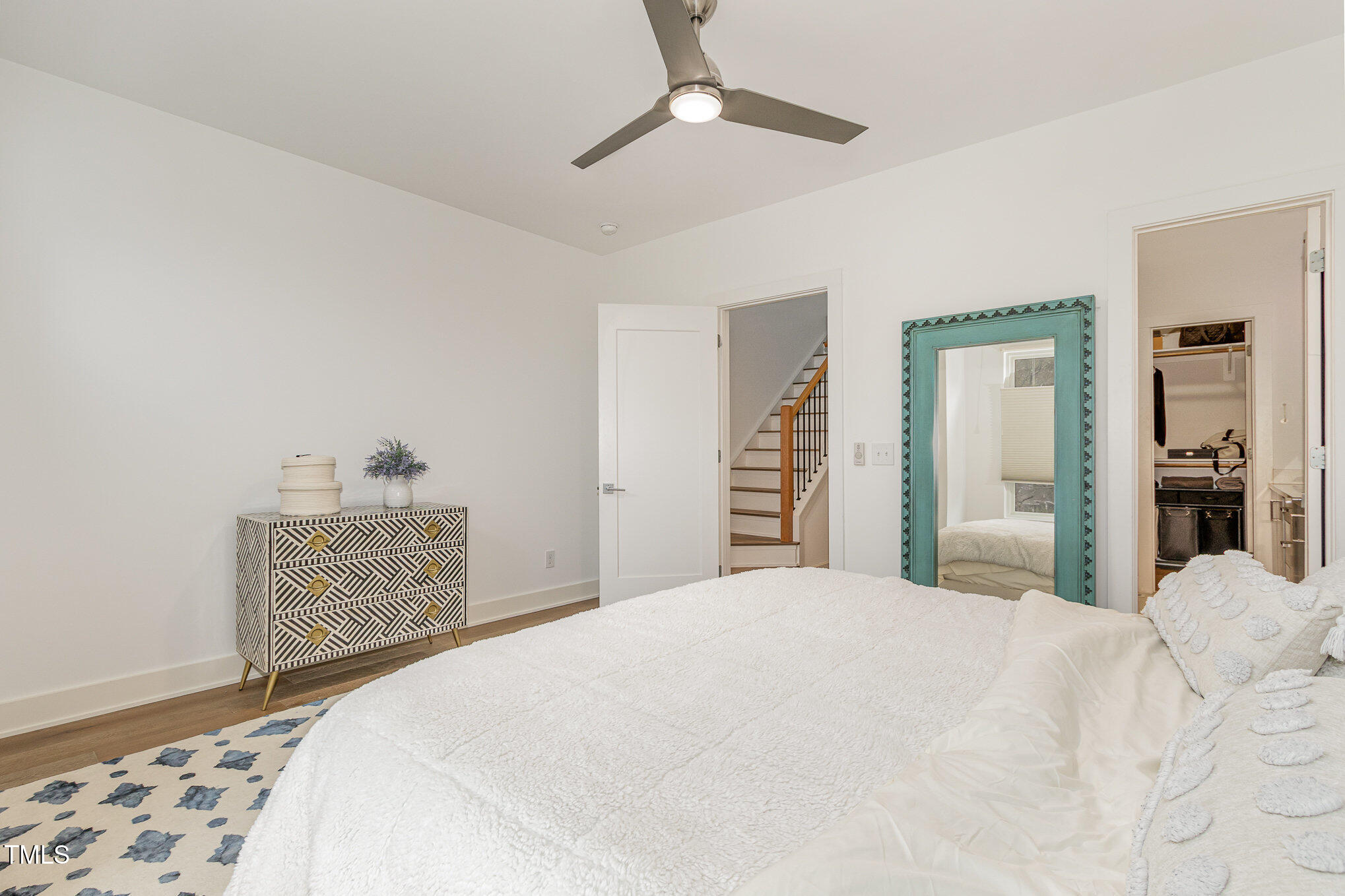 607 North Queen Street Durham, NC 27701 - Photo 16 of 35 a bedroom with a large bed and dresser