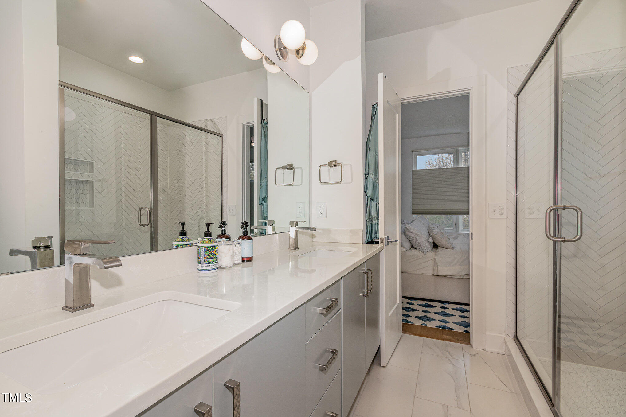 607 North Queen Street Durham, NC 27701 - Photo 19 of 35 a bathroom with a sink double vanity and a mirror