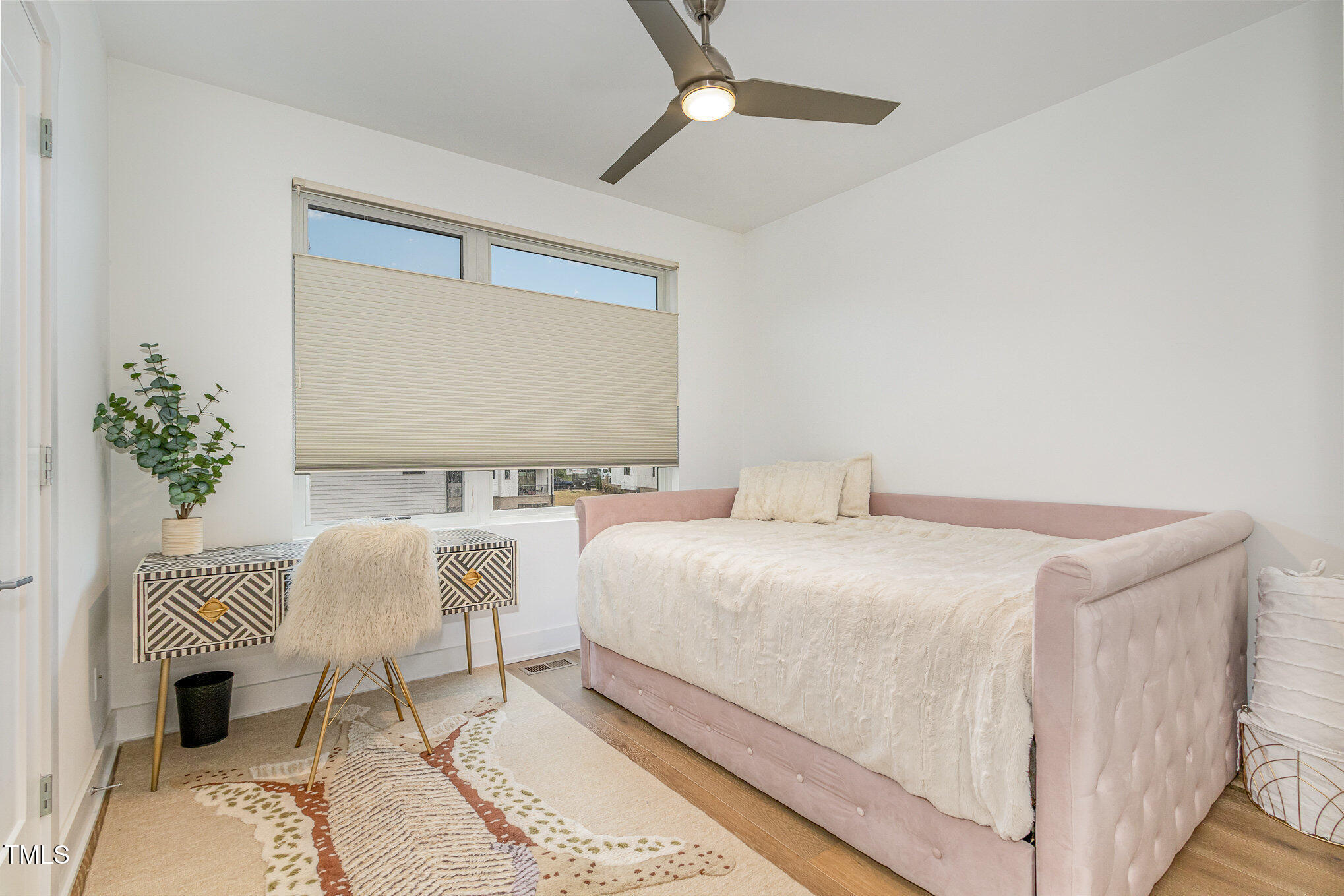 607 North Queen Street Durham, NC 27701 - Photo 20 of 35 a bedroom with a bed and a chandelier
