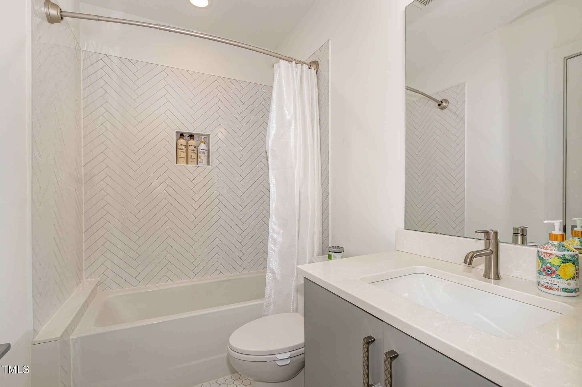 607 North Queen Street Durham, NC 27701 - Photo 21 of 35 a bathroom with a sink a toilet and shower