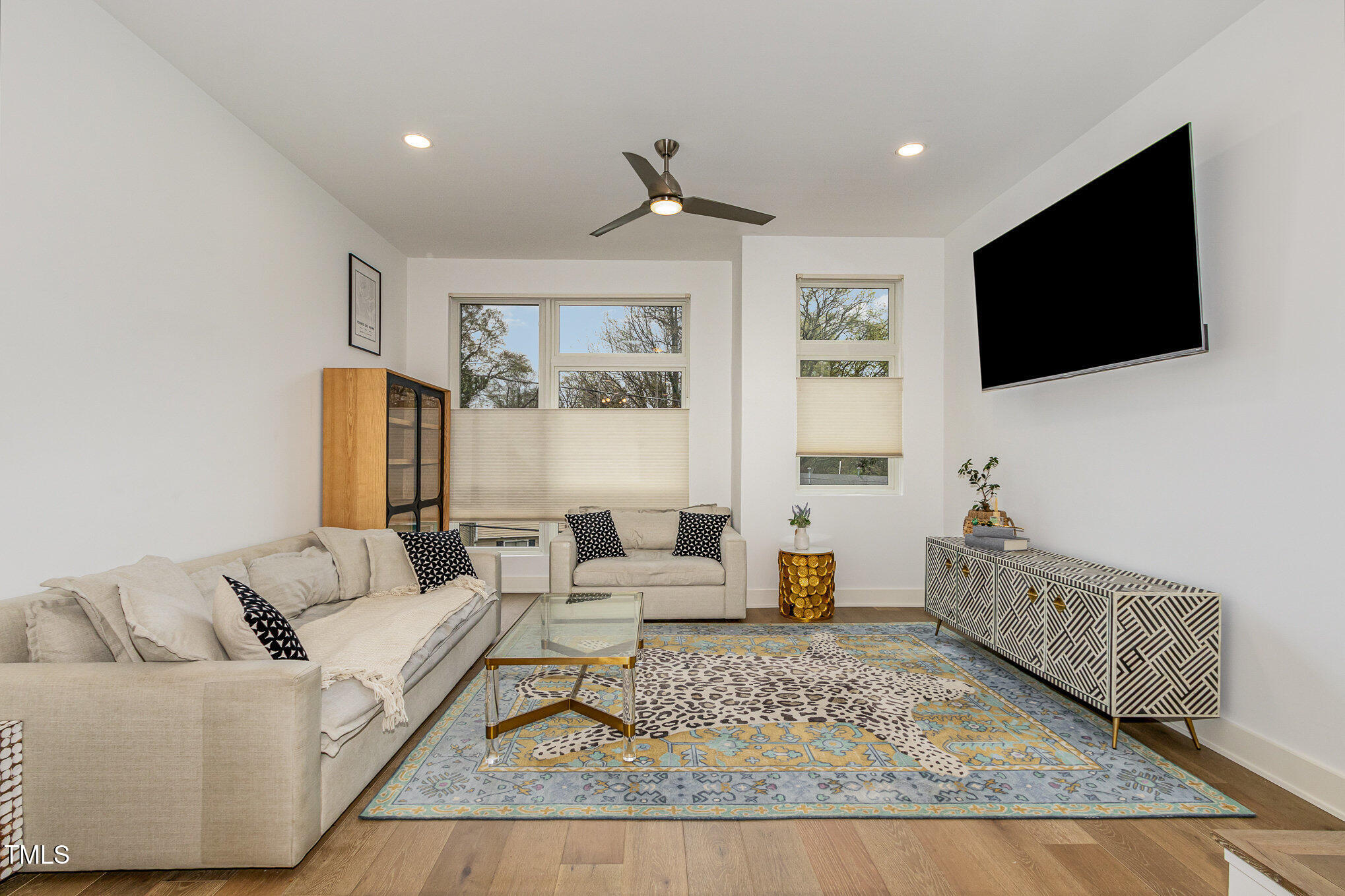 607 North Queen Street Durham, NC 27701 - Photo 5 of 35 a living room with furniture and a flat screen tv