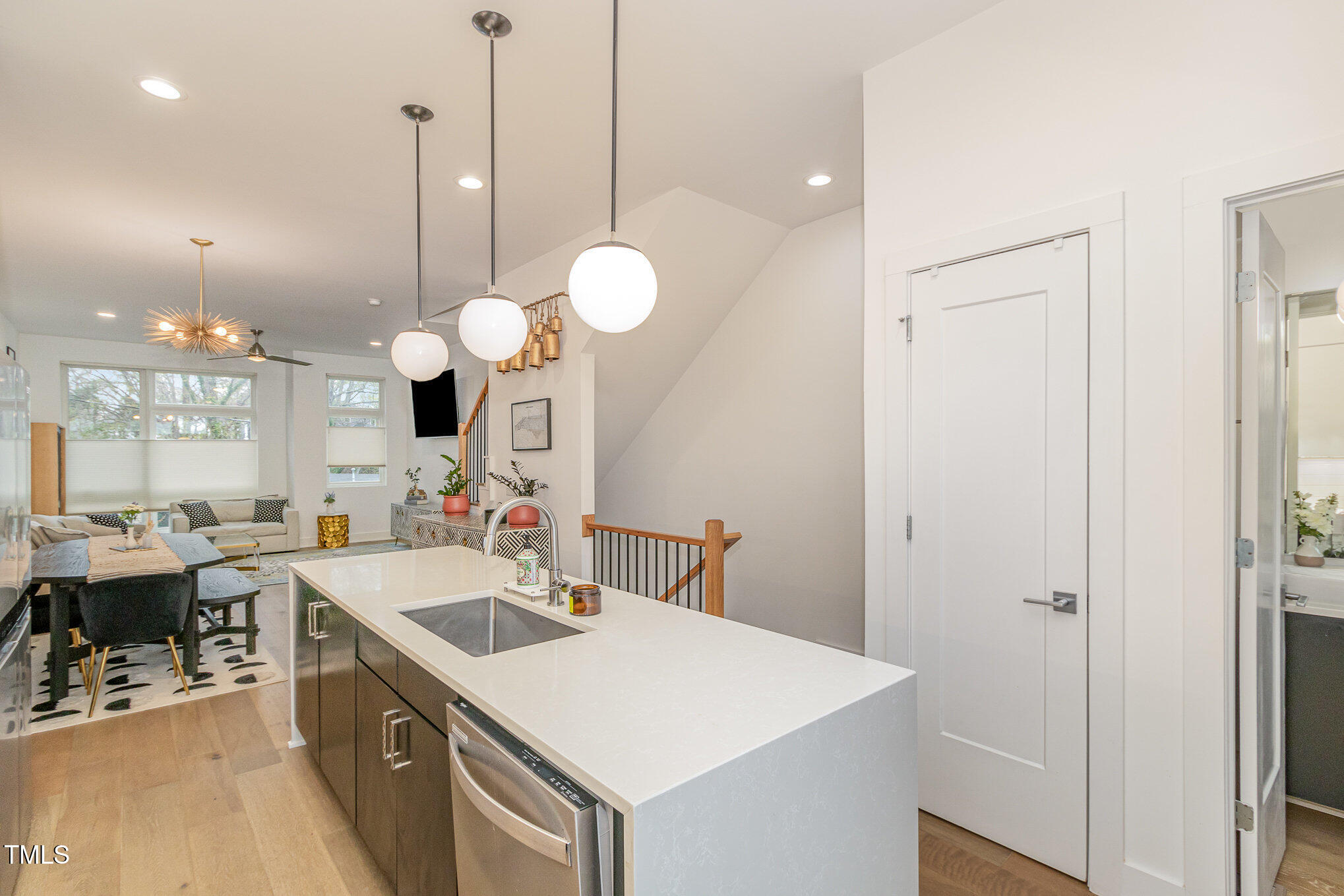 607 North Queen Street Durham, NC 27701 - Photo 10 of 35 a kitchen with a sink a stove and chairs