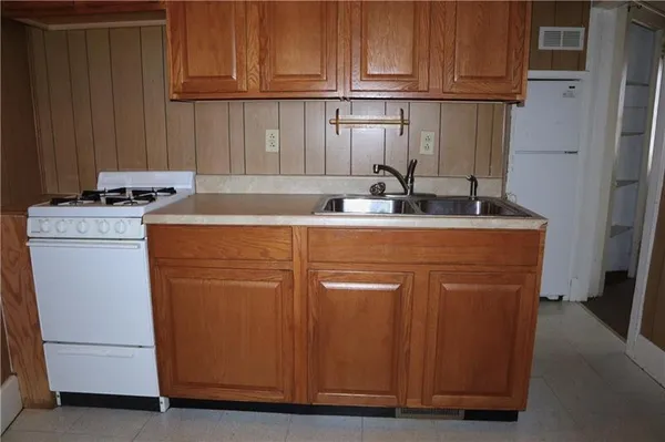 a kitchen with a stove top oven