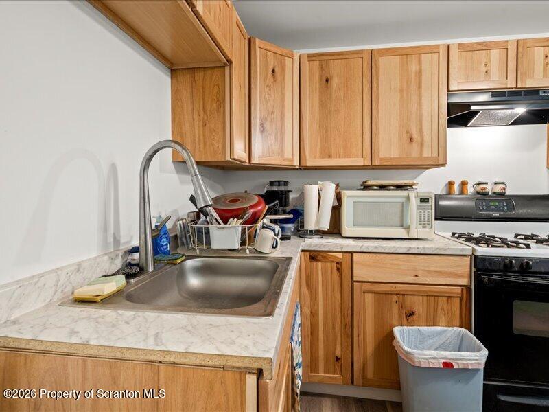 11 Padula Road Tunkhannock, PA 18657 - Photo 19 of 28 a kitchen with a sink a stove and cabinets
